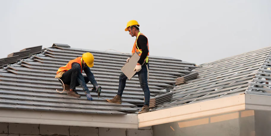 Photo of roofers installing roof tiles on home in Provo, Utah