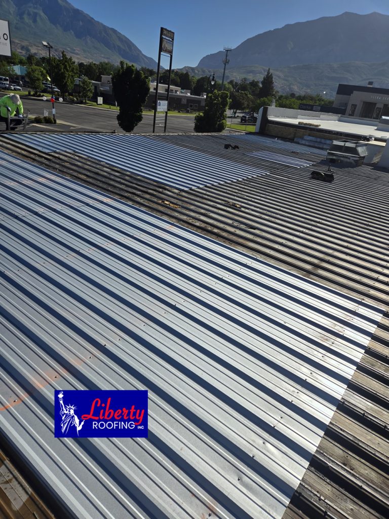 Fully completed fire restoration and Versico TPO commercial roof replacement in Provo, Utah by Liberty Roofing.