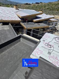 Luxury new construction home in Tuhaye near Park City with bronze TPO roofing system