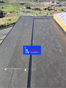 Close up of GAF bronze 60 mil TPO roof membrane installed on Park City luxury home
