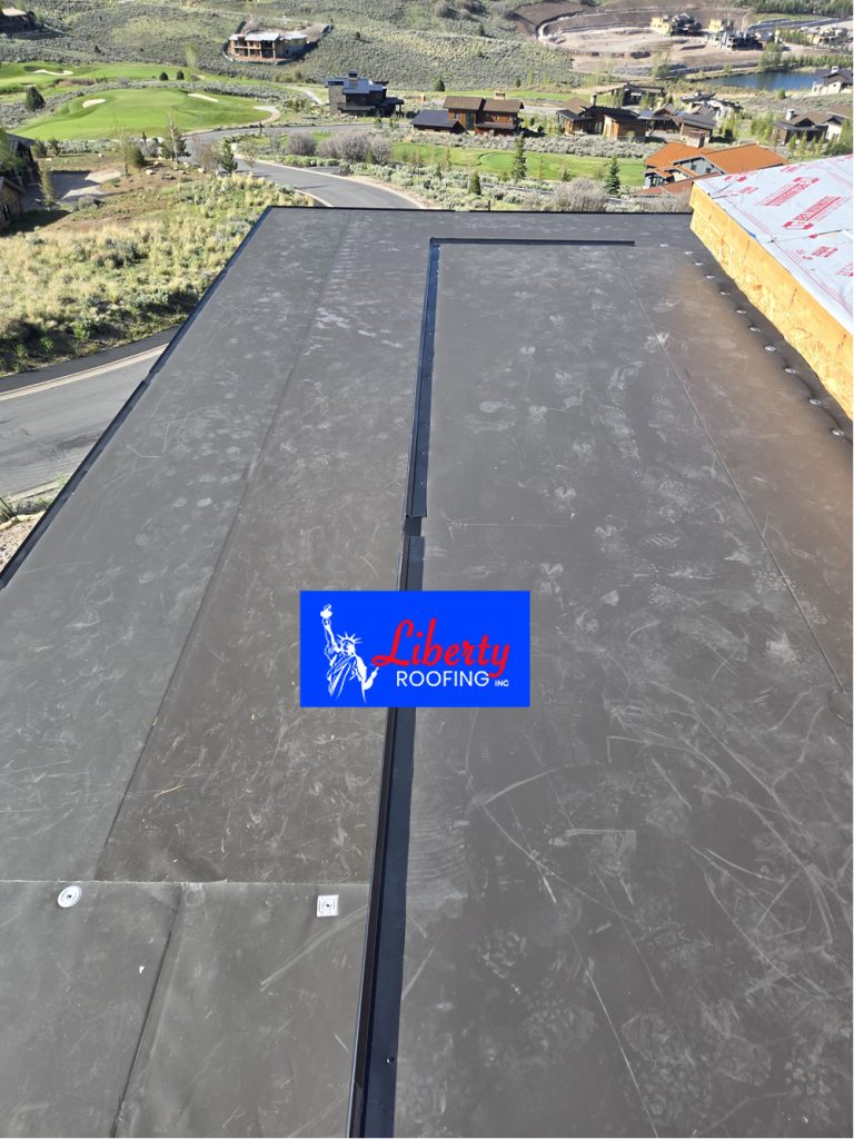Close up of GAF bronze 60 mil TPO roof membrane installed on Park City luxury home