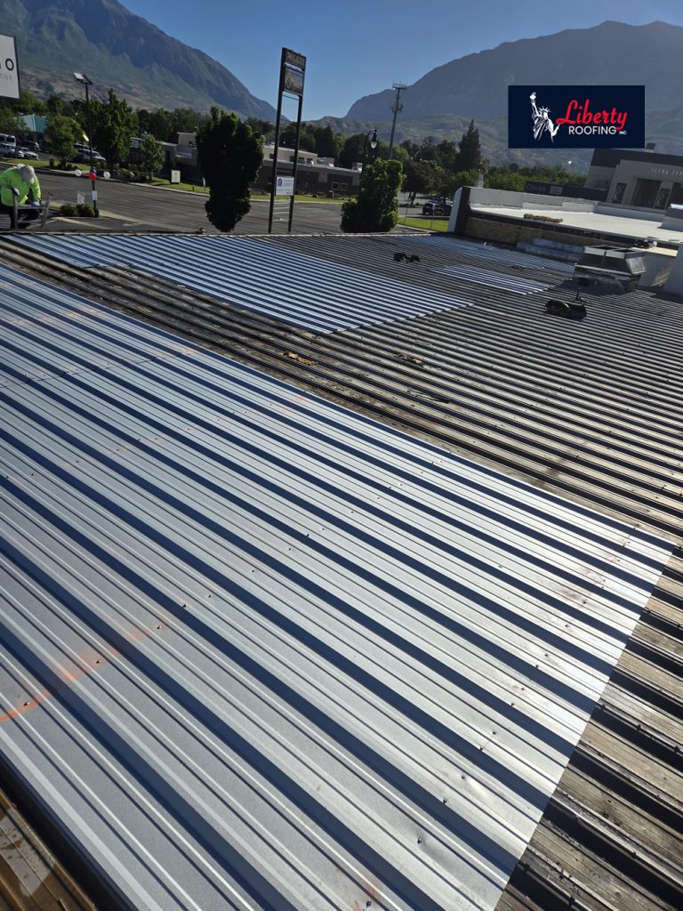Completed commercial roof featuring the new Versico 60 mil TPO membrane and replacement structural roof sections.
