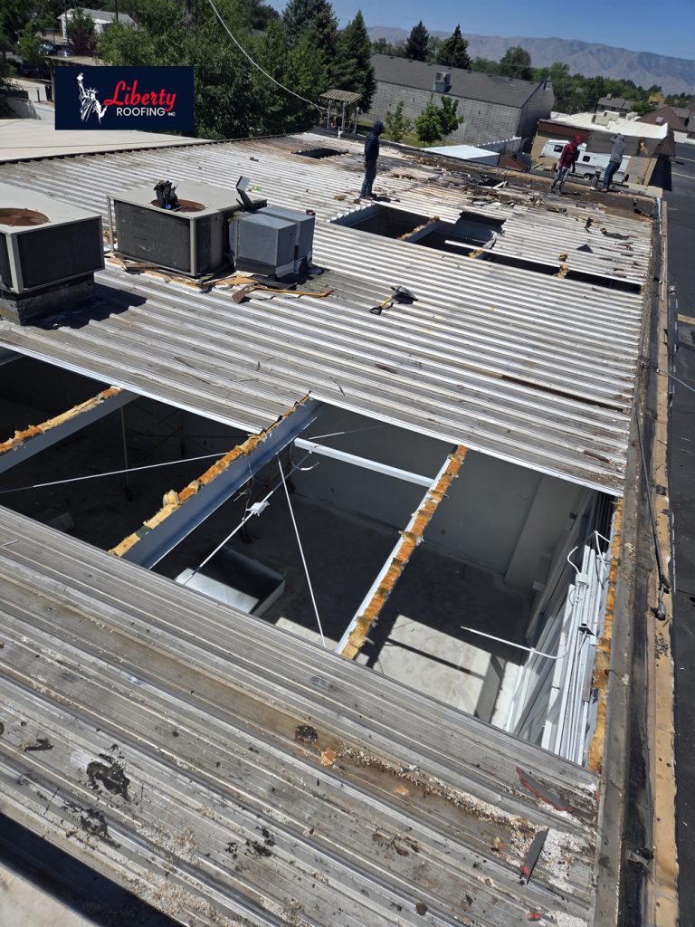 Additional close-up illustrating the amount of structural metal decking replaced during the project.