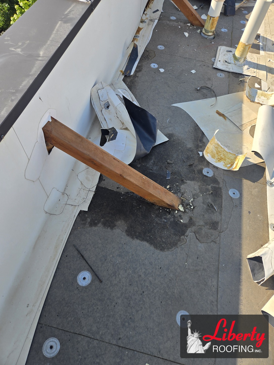 Old TPO roofing removed around pipes and a perimeter support in Pleasant Grove