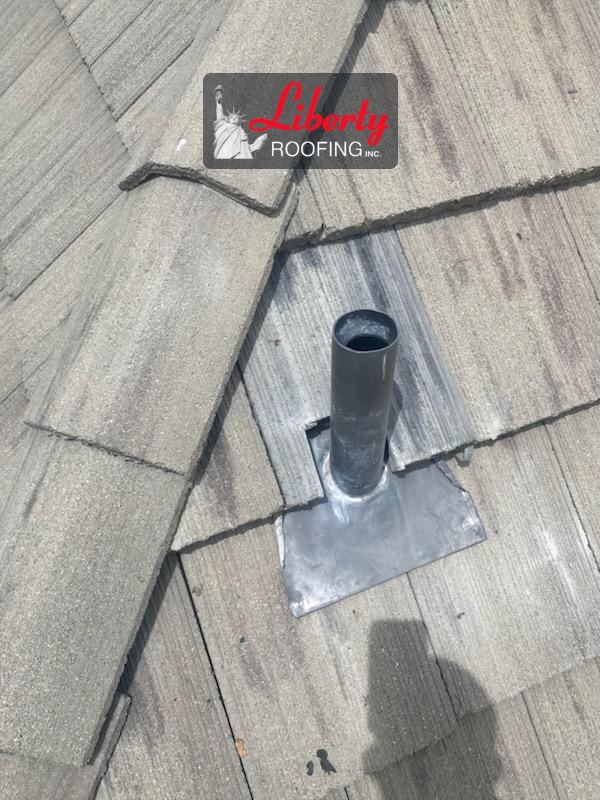 New lead pipe flashing installed around a roof pipe on a concrete tile roof in Provo